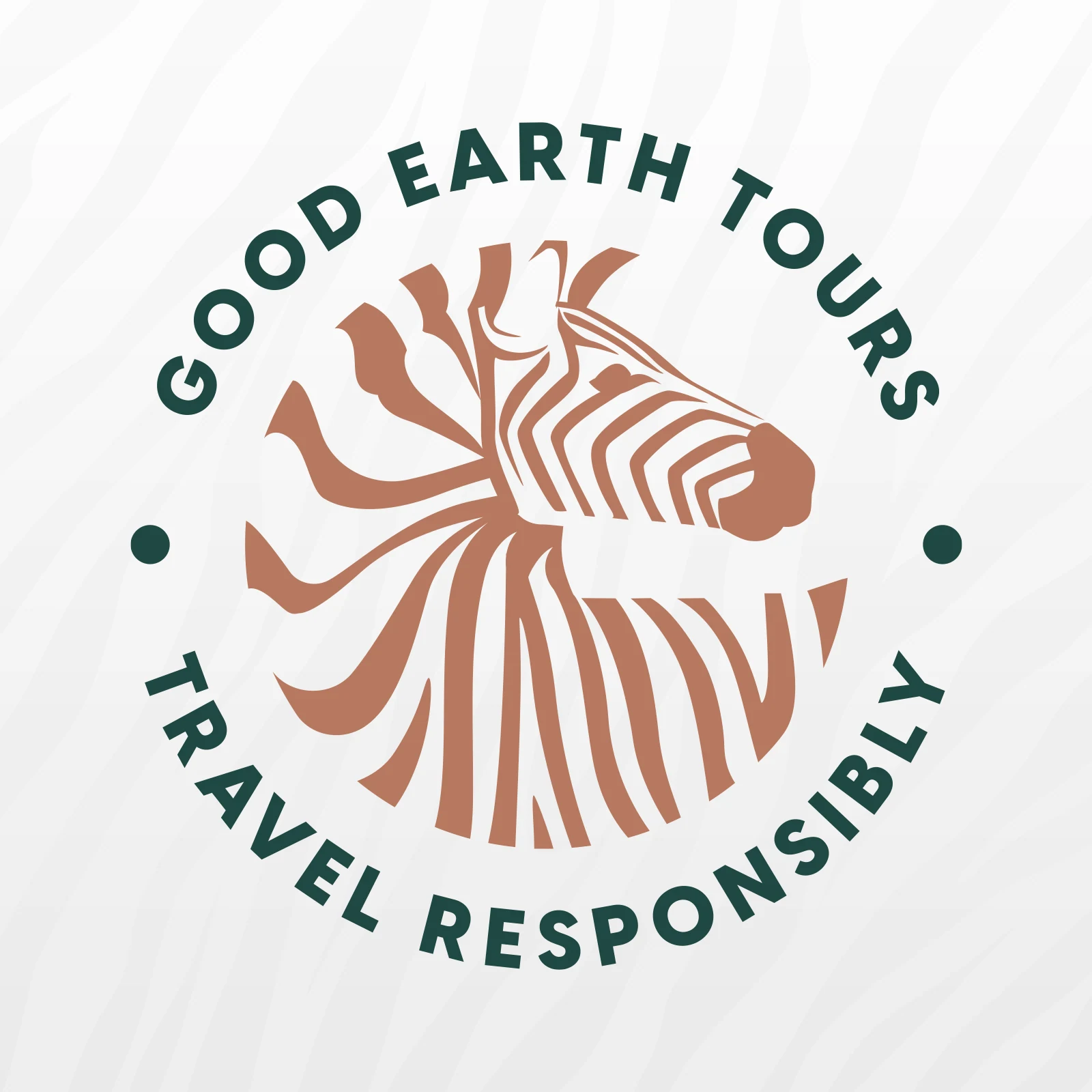 Good Earth Tours round badge, a terracotta zebra head ringed by Travel Responsibly